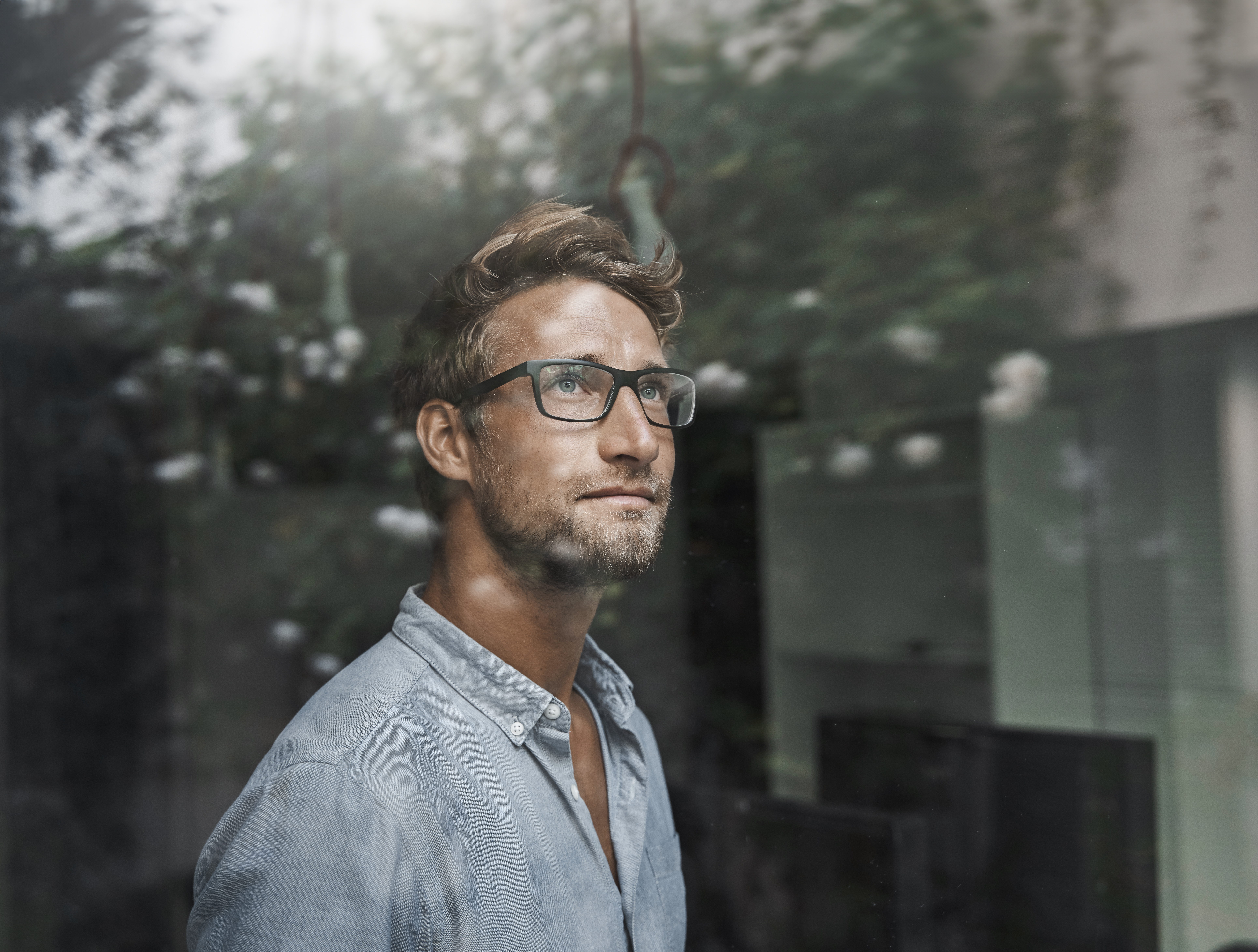 Man looking out of window